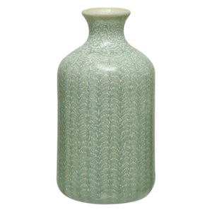 The CREATIVE COOP GRAY EMBOSSED STONEWARE VASE, MEDIUM features a tall, cylindrical shape with a narrow neck, flared rim, and textured leaf-like pattern—ideal as a decorative farmhouse accent.