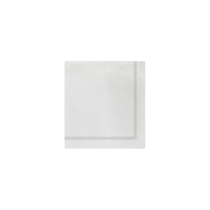 The VIETRI Fringe Cocktail Napkin, crafted from Italian spunlace, features a decorative green border on two adjacent sides forming a right angle. Ideal for cocktails, its design showcases evenly spaced vertical lines on a plain white background.