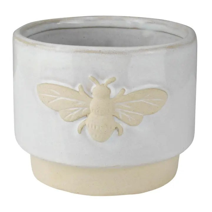 The HOMART CERAMIC BEE CACHEPOT is a charming 4" white ceramic planter with a beige base and a raised bee icon on the front.