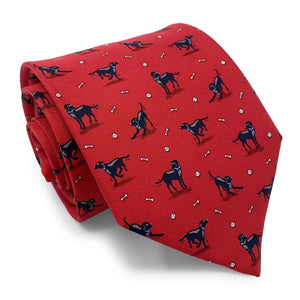 The BIRD DOG BAY - BLACK LAB TIE by BIRD DOG BAY is a blue necktie handmade in New York, featuring black Labrador dogs, white bones, and small white balls.