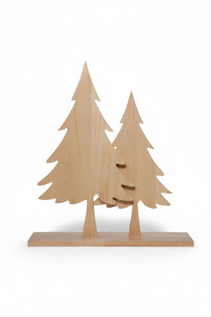 Six ASH WOOD SILHOUETTE TWO TREES ON BASE ornaments, arranged with pinecones on a tabletop.