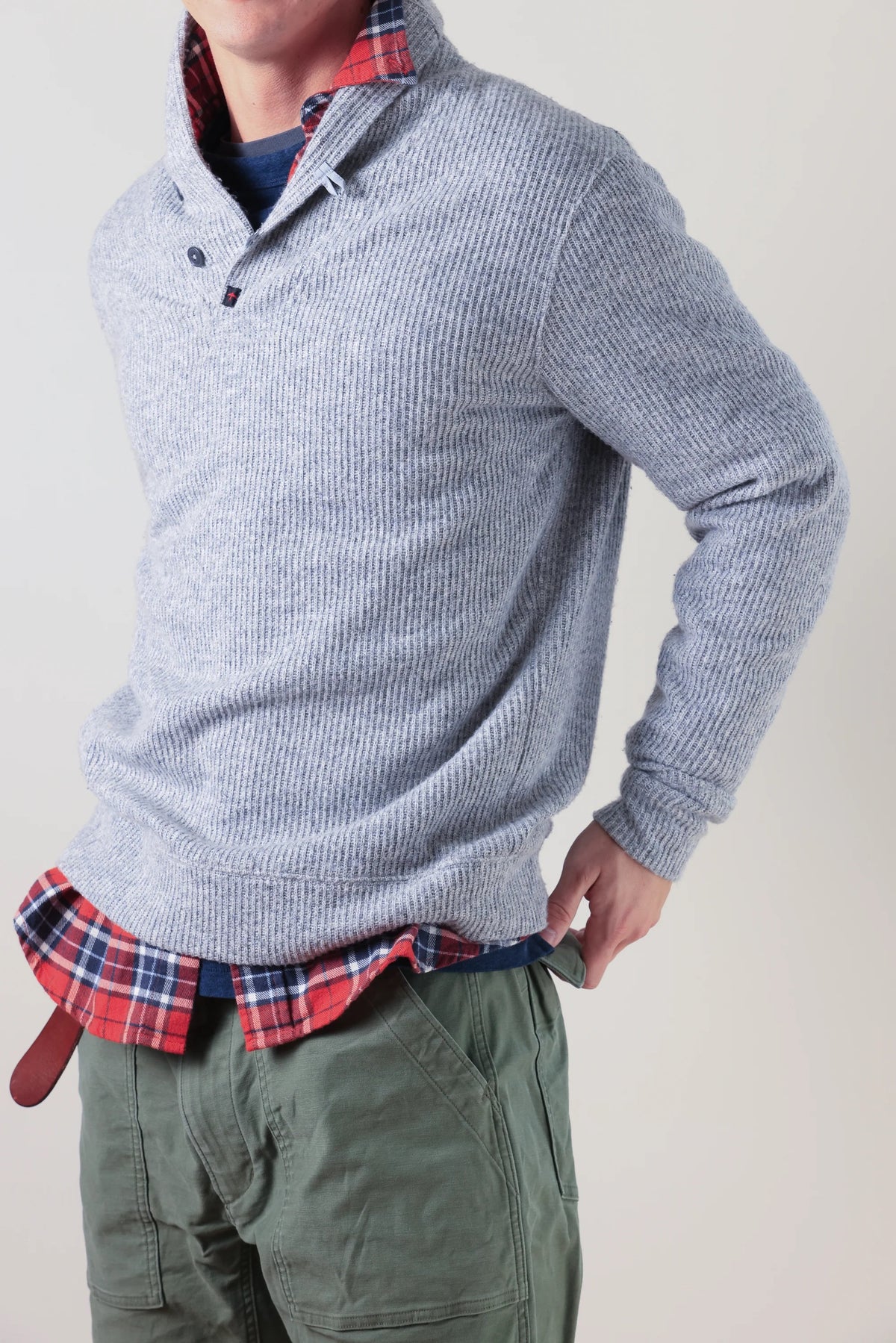 The RELWEN Ridge Twist Shawl Sweater in Pale Grey Heather is a vintage-style piece with ribbed cuffs and hem, a hood, and a small tag near the neckline, shown laid flat on a white background.