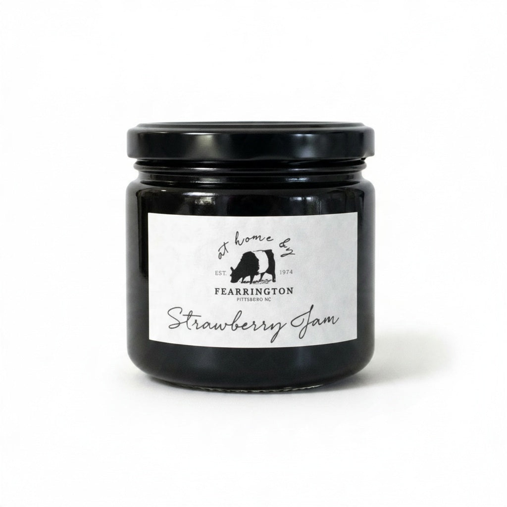 Introducing the FEARRINGTON HOUSEMADE STRAWBERRY JAM from the FEARRINGTON SIGNATURE COLLECTION, this jar of delicious strawberry jam is adorned with a charming black and white striped ribbon tied around the lid. Perfect as a hostess gift, its label lists wholesome ingredients such as strawberry, vanilla, lemon, pectin, and sugar. This handmade treat may contain allergens and is a delightful choice for breakfast jam enthusiasts.