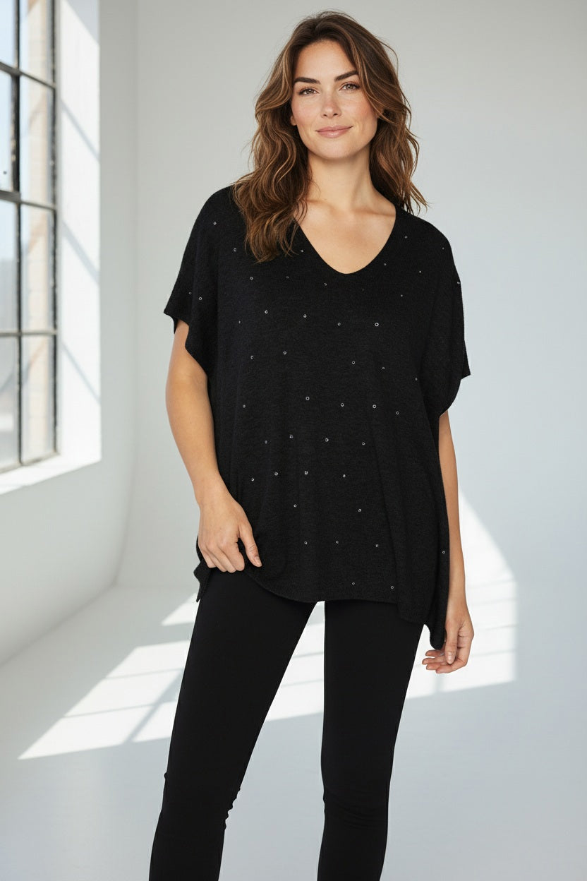 Close-up texture of the KINROSS CASHMERE - CRYSTAL VEE POPOVER by KINROSS, featuring soft black wool with a subtle, fuzzy knit—ideal inspiration for luxury sweater styling.