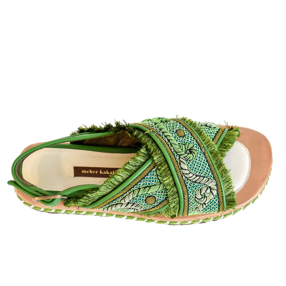 Explore the MEHER KAKALIA DA GAMMA BLOC sandal in Kelly Green Parrot, where comfort meets style. This open-toe sandal has a hand-embroidered design with fringe detailing, a thick textured sole with woven accents, an adjustable ankle strap, and a layered platform design.