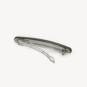 The MACHETE Slim Paris Barrette in Meadow, a long, slender green hair accessory with light and dark streaks, made from Italian acetate by MACHETE, is centered on a plain white background.