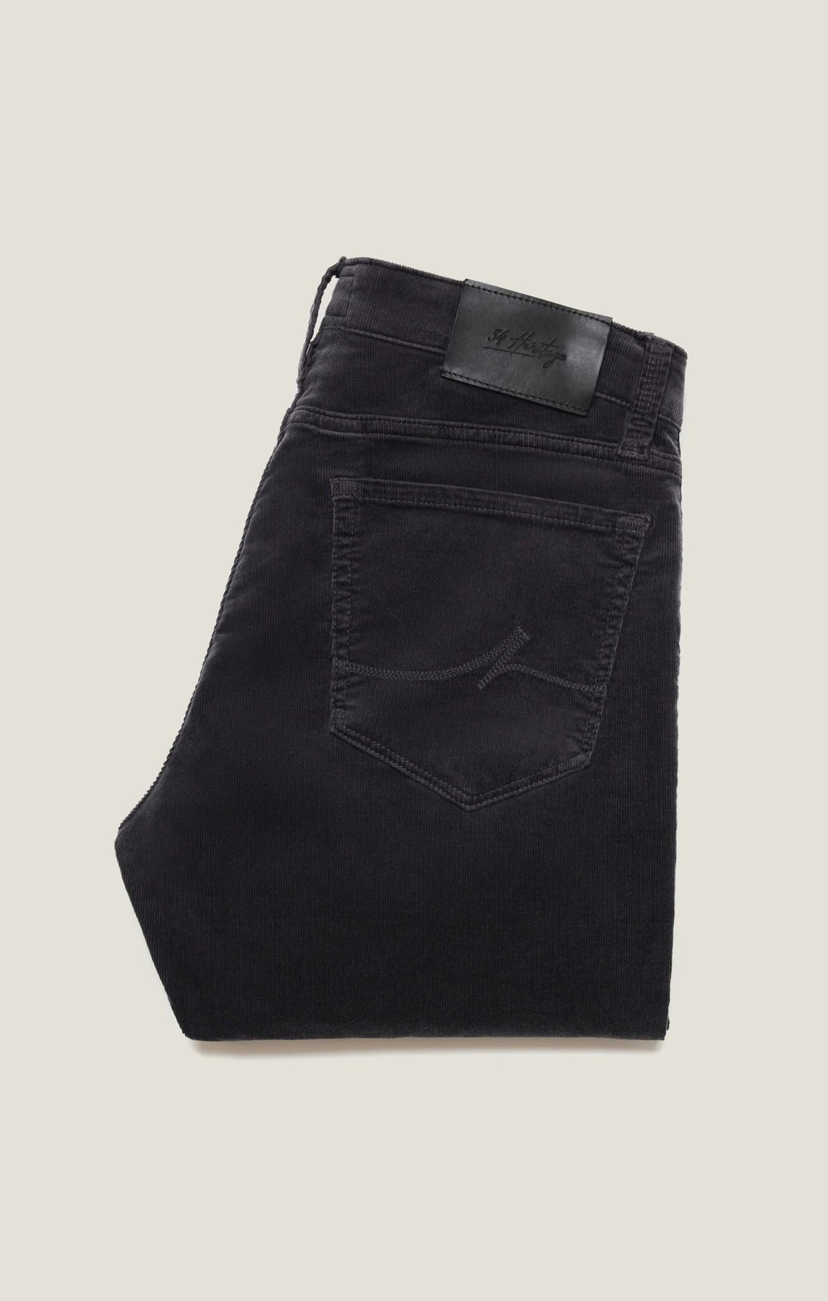 34 HERITAGE - CHARISMA RELAXED STRAIGHT LEG CORDUROY PANTS IN CHARCOAL worn with a red long-sleeve shirt and black leather boots.