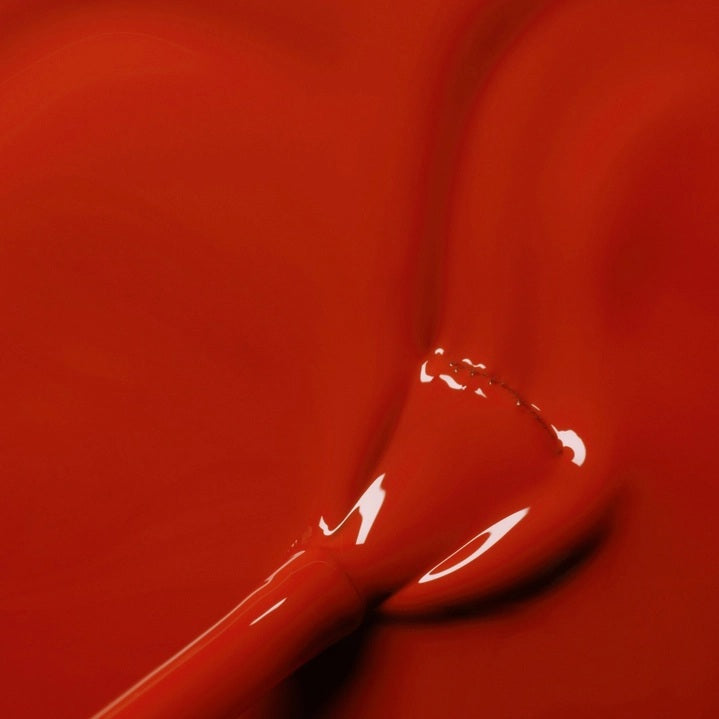 Discover a color chart featuring twelve stunning red lipstick shades—Coral Reef, Brique, Lava, Terracotta, Spicy, Indian Summer, Red Coral, Dark Dahlia, Poppy Red, Red Velvet, Anémone, Pomegranate, Red Cherry, and Bohème—each beautifully enhanced by pairing with MANUCURIST GREEN™ Nail Polish in Indian Summer from MANUCURIST INC for a perfectly polished and coordinated look.