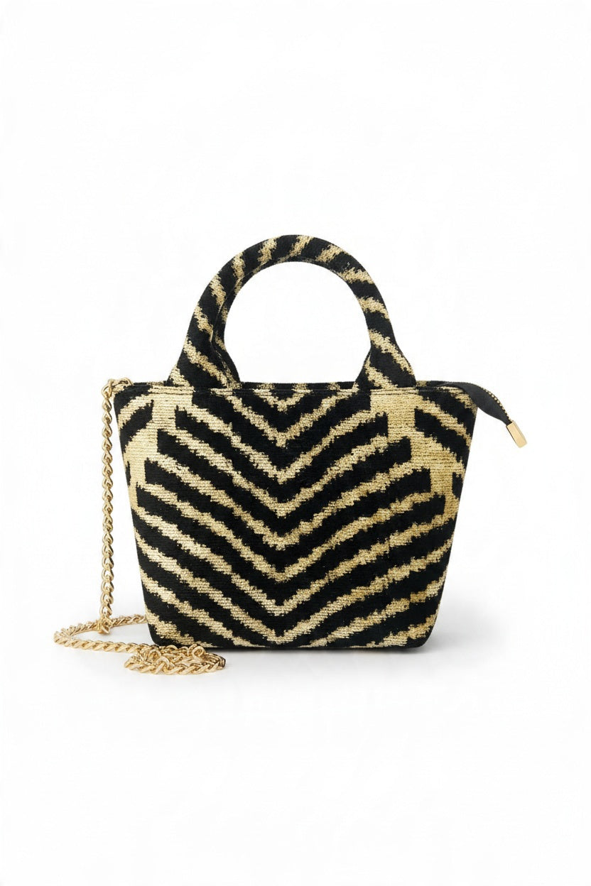 BALDIZ - DESERT MINI CYPRESS BAG in a gold and black chevron pattern, featuring two top handles and a detachable gold chain shoulder strap.