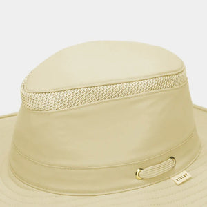 The TILLEY AIRFLO Broad Brim Hat LTM6 in Khaki Olive features mesh ventilation around the crown for outdoor use. Shown on a plain light background, this wide-brimmed sun protection hat is crafted by TILLEY.