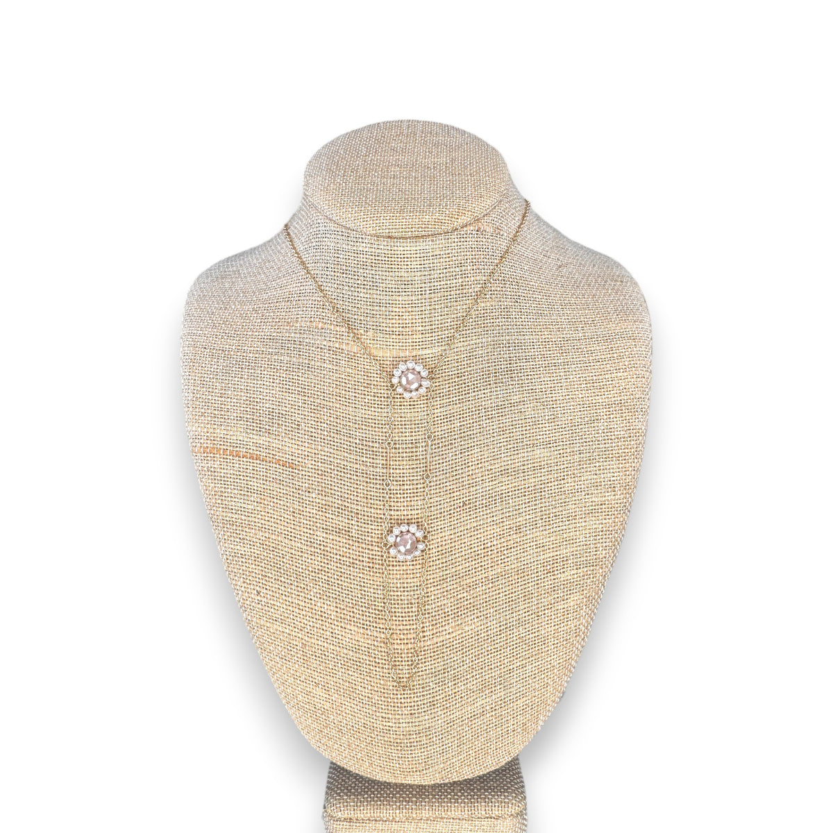 The GOLDISH - Floral Pink Moonstone and White Pearl Ladders to Bliss Necklace by GOLDISH is shown on a beige linen bust against a white background.