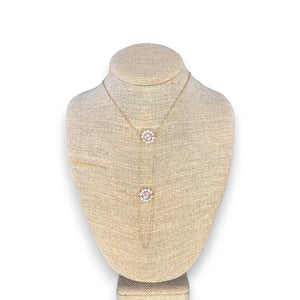 The GOLDISH - Floral Pink Moonstone and White Pearl Ladders to Bliss Necklace by GOLDISH is shown on a beige linen bust against a white background.