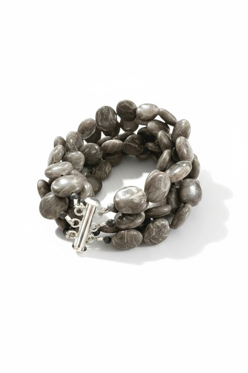 The ANN LIGHTFOOT Brown Jasper Coin Five Strand Bracelet features chunky, polished brown jasper stones and a stainless steel clasp, shown on a plain white background.
