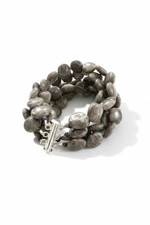 The ANN LIGHTFOOT Brown Jasper Coin Five Strand Bracelet features chunky, polished brown jasper stones and a stainless steel clasp, shown on a plain white background.