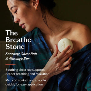 The KATE MCLEOD BREATHE STONE | SOOTHING CHEST RUB, a round white moisturizer stone with eucalyptus peppermint, is shown partially wrapped in cloth next to its green and orange box. A "LIMITED EDITION" red circle appears above on a pale yellow background.
