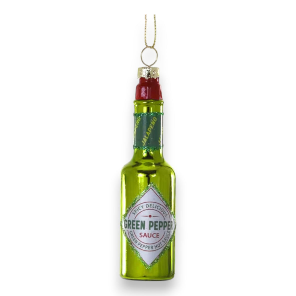 The CODY FOSTER GREEN PEPPER HOT SAUCE ORNAMENT is a shiny green glass decoration shaped like a hot sauce bottle, labeled &quot;Green Pepper Sauce&quot; with a gold hanging loop—ideal for collectors or as a unique gift.