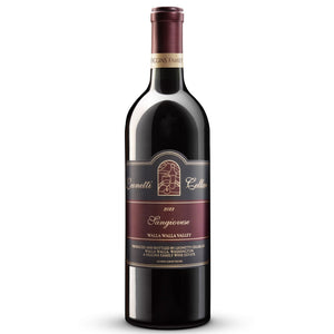 A bottle of LEONETTI SANGIOVESE 2023 by WINE: WINEBOW rests on a countertop, while shelves filled with assorted wine bottles appear blurred in the background.