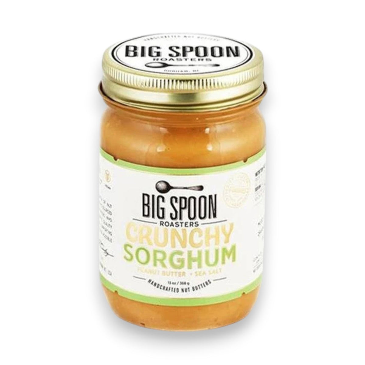 A jar of BIG SPOON ROASTERS - PEANUT CRUNCHY SORGHUM NUT BUTTER, featuring a metal lid and a white label with black and yellow text, this distinctive spread from BIG SPOON ROASTERS is crafted with coarse-ground peanut butter for exceptional texture.