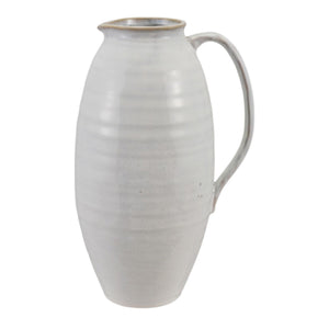 The WHITE STONEWARE PITCHER by CREATIVE COOP features a tall, oval shape, narrow neck, single curved handle, and a smooth light gray finish.