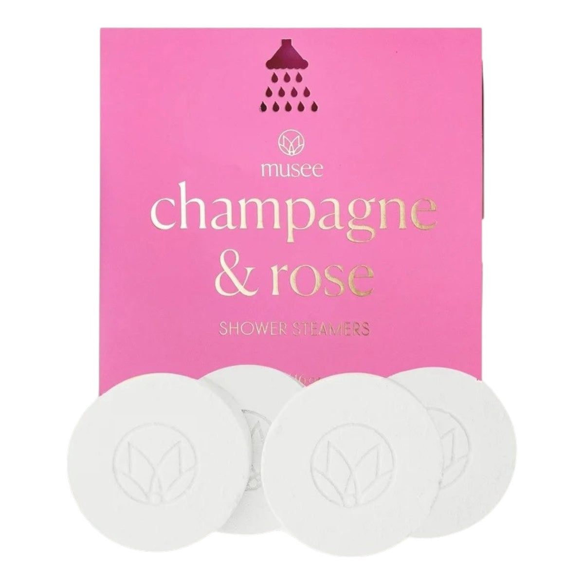 Four round white shower steamers are placed in front of a pink MUSEE package labeled “MUSEE - CHAMPAGNE & ROSE SHOWER STEAMERS” in gold and white text with a small showerhead graphic above, offering a natural bath product designed to turn your daily routine into a luxurious spa shower experience.
