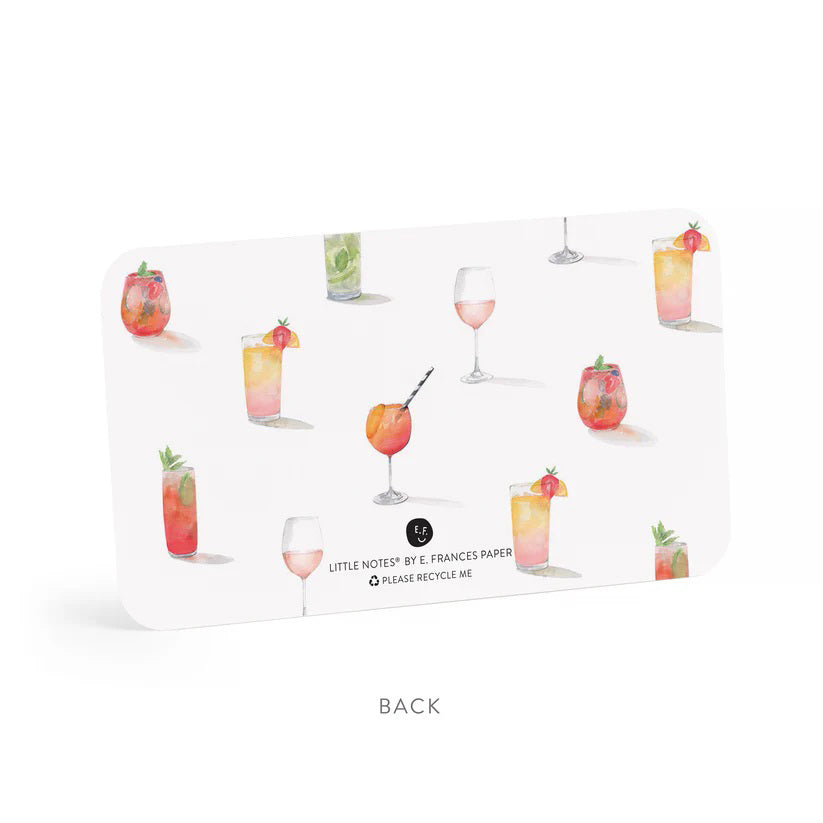 A clear box contains "E. FRANCES PAPER - APEROL SPRITZ LITTLE NOTES" featuring tiny notecards. The front card displays a watercolor of a cocktail with a striped straw and the phrase "use unsparingly.