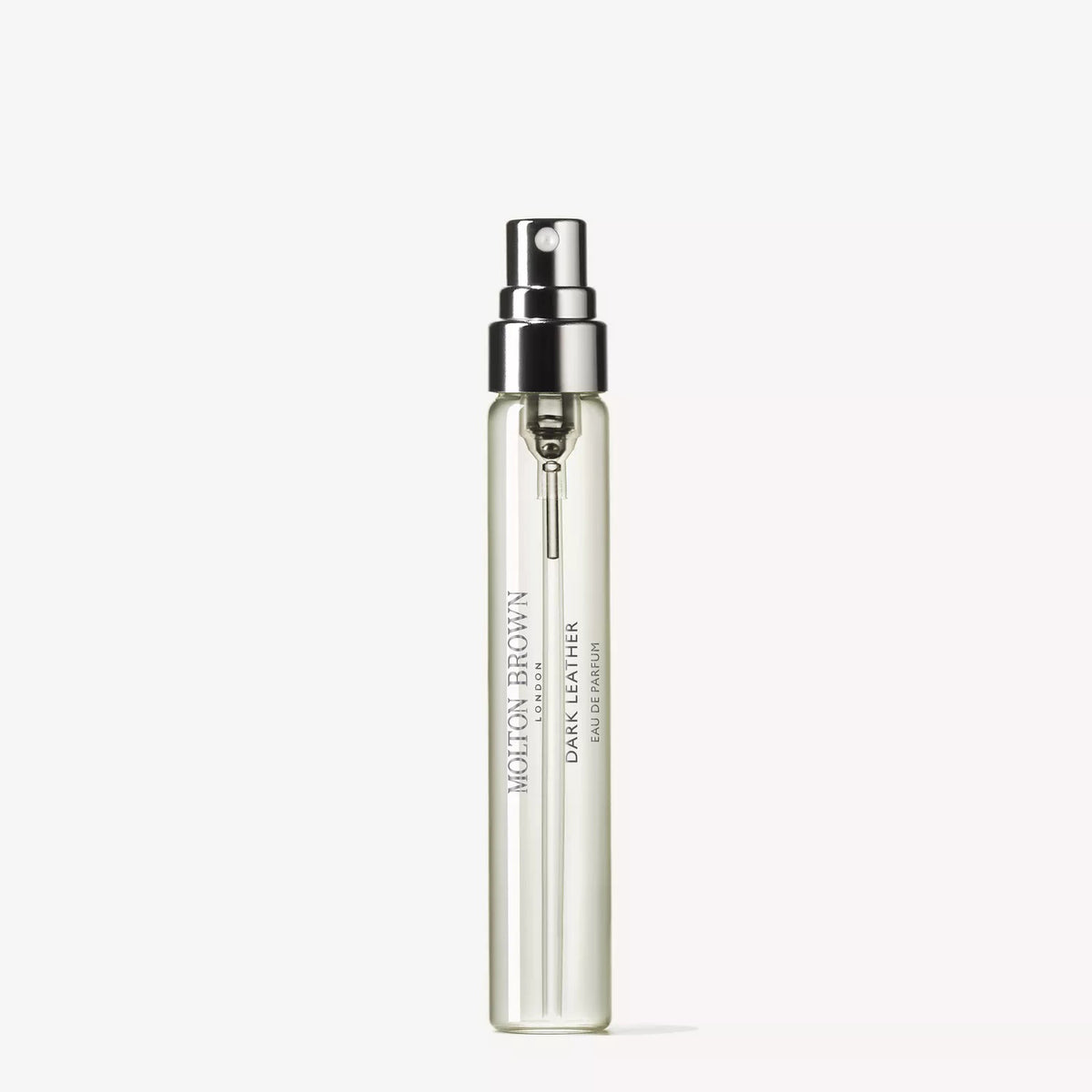 A clear glass bottle of MOLTON BROWN Dark Leather Travel Eau de Parfum 0.25fl oz with a silver nozzle sits on a white background, revealing an elegant woody fragrance with smoky leather notes for a sophisticated scent.