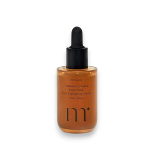 A hand holds a dropper bottle with MOLVANY - CASTANEA CRENATA INNER SHELL PORE TIGHTENING SERUM infused with Korean Yulpi extract. The label reads "Apply Post CIS Essence for Optimal Absorption" and is dedicated to those concerned about pores and skin hydration. Brand: HONG CHEON USA, INC.