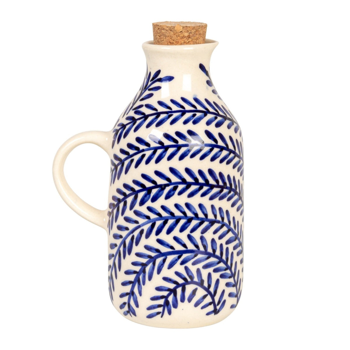 The HAND-PAINTED STONEWARE OIL CRUET WITH CORK STOPPER by CREATIVE COOP features blue leaf patterns and a handle, making it a perfect addition to rustic kitchen decor. Shown on a white background with the cork beside it.