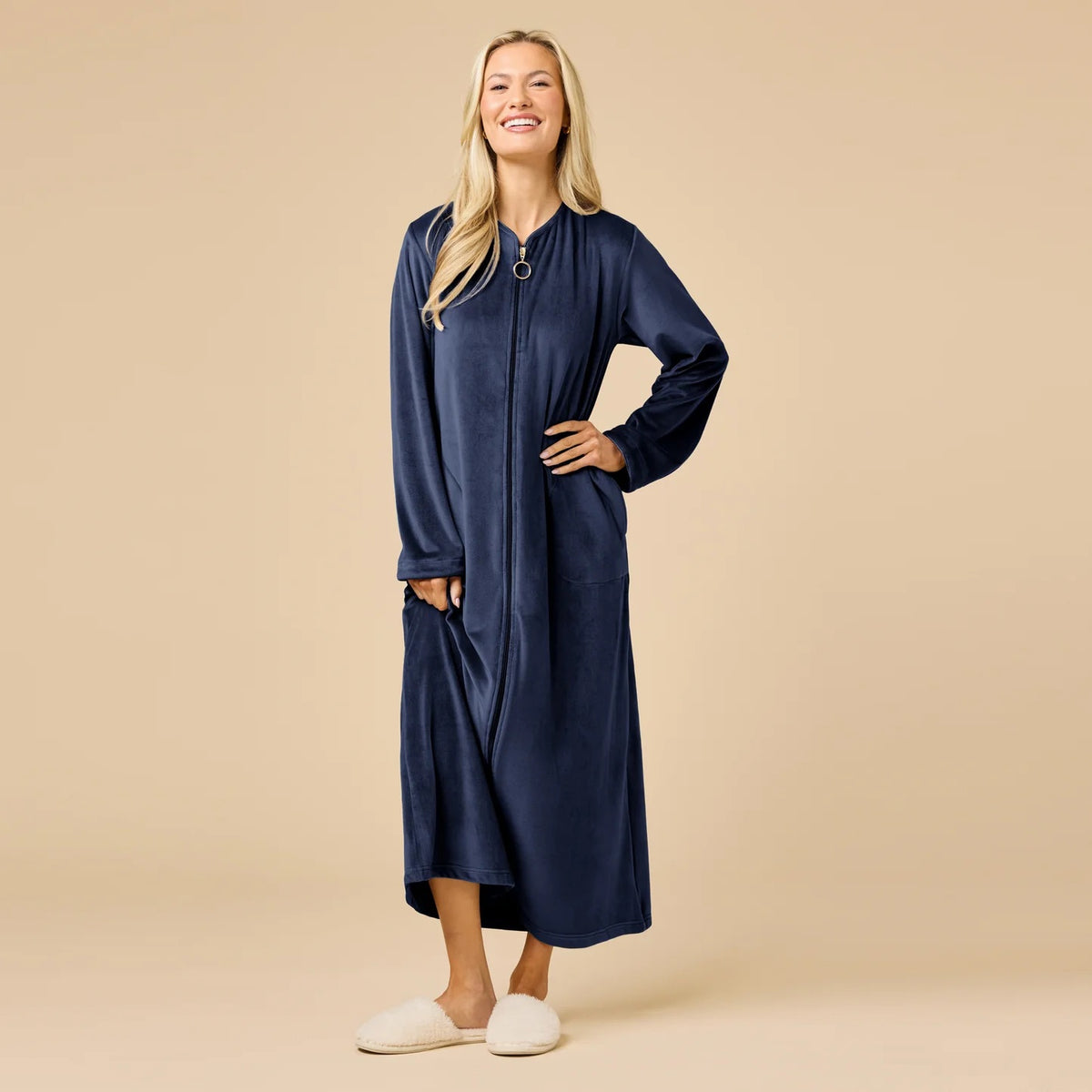 A long-sleeved, beige SOFTIES - SERENITY SHEAR MINK ZIP ROBE featuring a full-length zipper, round neckline, and two side pockets.