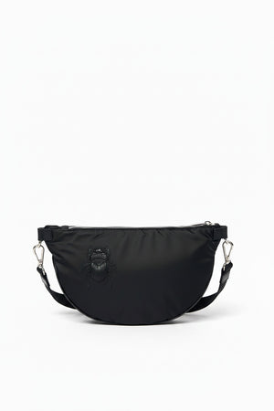 The GABRIELE FRANTZEN - SCARAB NYLON XL BELTBAG IN BLACK is a half-moon crossbody bag crafted from luxurious Italian nylon, featuring a matching black scarab beetle design on the front, silver-tone hardware, and an adjustable strap. This sleek nylon beltbag by GABRIELE FRANTZEN is displayed against a plain white background.