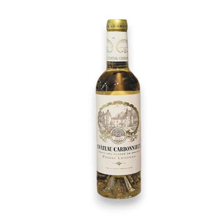 A 375ml bottle of CHATEAU CARBONNIEUX by Monsieur Touton, vintage 2020, from Pessac-Léognan's Graves region features a gold foil and a detailed label with a chateau illustration and traditional winemaking motifs.