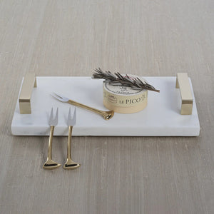 A set of four ZODAX Cheese and Cocktail Forks is arranged diagonally on a white background, their gold handles reflecting the light.
