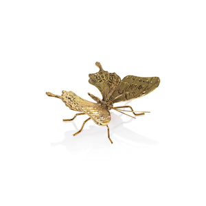 The ZODAX DECORATIVE ANTIQUE GOLD BUTTERFLY - SMALL is a gold-colored zinc alloy sculpture with textured wings and six thin legs. Displayed on white, it measures 3.25" x 2.5" x 1.5".
