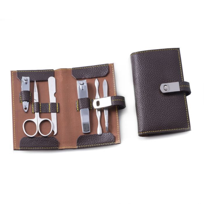 The BEYBERK INTERNATIONAL LEATHER MANICURE CASE SET is shown open with stainless steel nail scissors, clippers, tweezers, and tools; another case is displayed closed with a snap button.