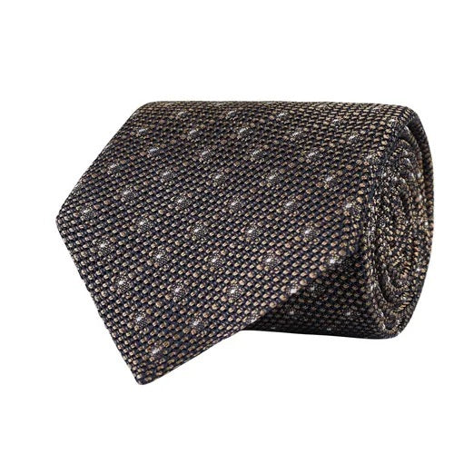 The AMANDA CHRISTENSEN Polka Dot Grenadine Woven Silk Tie in Beige features a textured, patterned fabric with small beige and brown dots on a dark background, beautifully highlighting exquisite Italian craftsmanship.