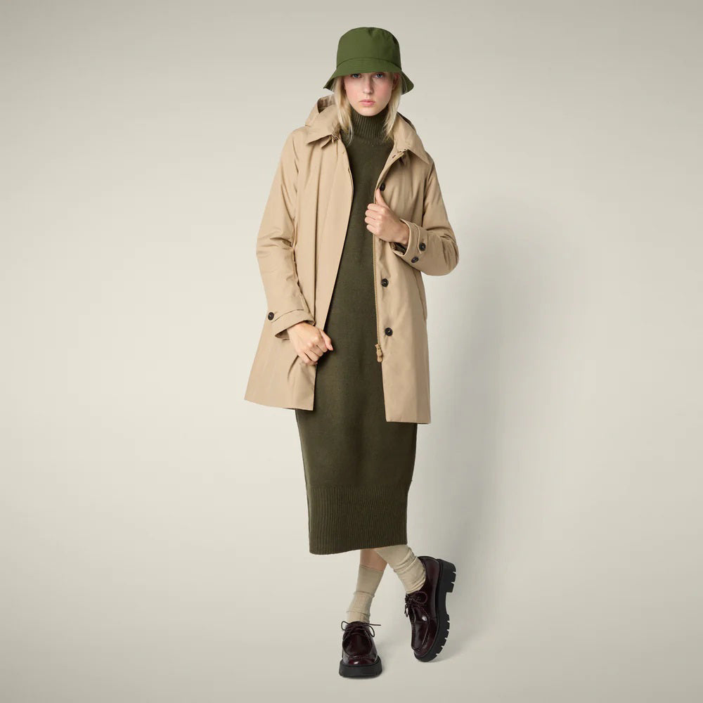 The SAVE THE DUCK - EMBIE COAT is a light beige, mid-length women&#39;s raincoat by SAVE THE DUCK, made from waterproof recycled polyester with a hood, buttoned front, side pockets, and adjustable cuffs. Shown on a plain white background.