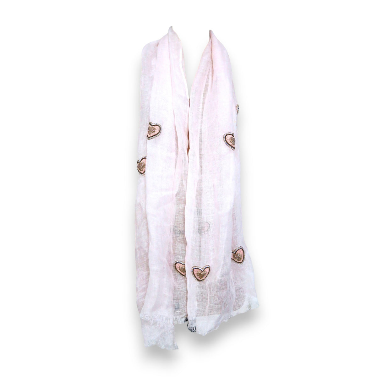 The CITRUS FASHIONS POWDER PINK LINEN SCARF WITH EMBROIDERED HEARTS features a soft, lightweight texture and raw fringe edges, offering casual elegance on a plain white background.