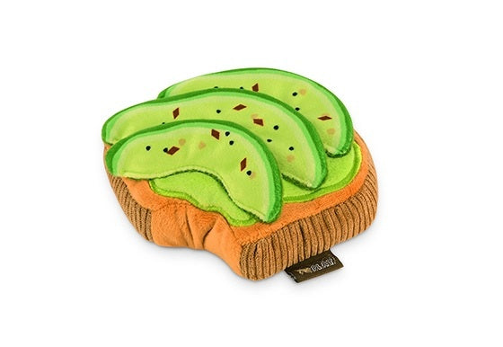 Introduce your pup to the BARKING BRUNCH - AVO-DOGGO TOAST by PLAY PET LIFESTYLES/BRANDS—a durable dog toy shaped like a slice of toast, topped with three avocado slices and decorated with embroidered seeds and seasoning. Perfect for playful pups who love dog brunch toys, it’s also machine washable for easy cleaning.