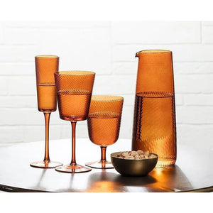 Amber-tinted OPTIC SWIRL ALL PURPOSE GLASS with a subtle diagonal swirl optic pattern and a delicate stem.