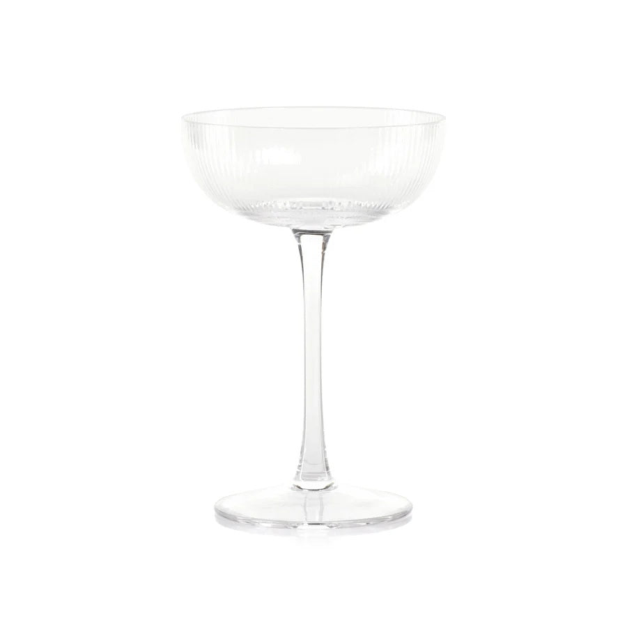 The ZODAX OPTIC DESIGN MARTINI GLASS, with its wide, shallow bowl and slender stem, stands upright against a white background—ideal for modern bars or as an elegant martini glass alternative.