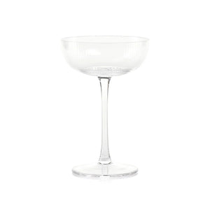 The ZODAX OPTIC DESIGN MARTINI GLASS, with its wide, shallow bowl and slender stem, stands upright against a white background—ideal for modern bars or as an elegant martini glass alternative.