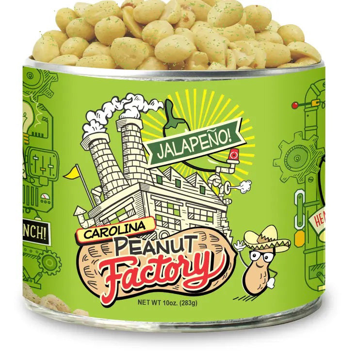 A cylindrical can of 1949 Nut Company Jalapeño Peanuts. The green label features a cartoon factory, a smiling peanut wearing a sombrero, and various playful graphics. The can is open, showing the spicy peanuts inside. Net weight: 10 oz (283g).