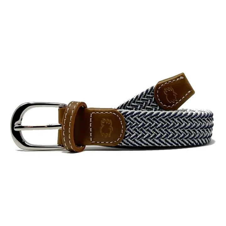 The ROOSTAS Magnolia Woven Stretch Belt features a black and white herringbone pattern, brown leather accents, a silver buckle, embossed animal logo, and white stitching for a refined look.