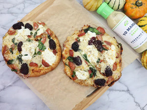 A bottle of YO MAMA'S - AMERICAN RANCH from YO MAMA'S FOODS is displayed against a white background. The green-capped bottle, labeled "dairy-free, gluten-free," and "no sugar added," contains 13 oz (368g) of hand crafted Ranch Dressing & Dip.