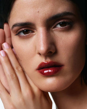 A beige tube of U BEAUTY THE PLASMA LIP COMPOUND 15ML stands upright, featuring white text and logo—ideal for natural lip enhancement and plumping treatment.