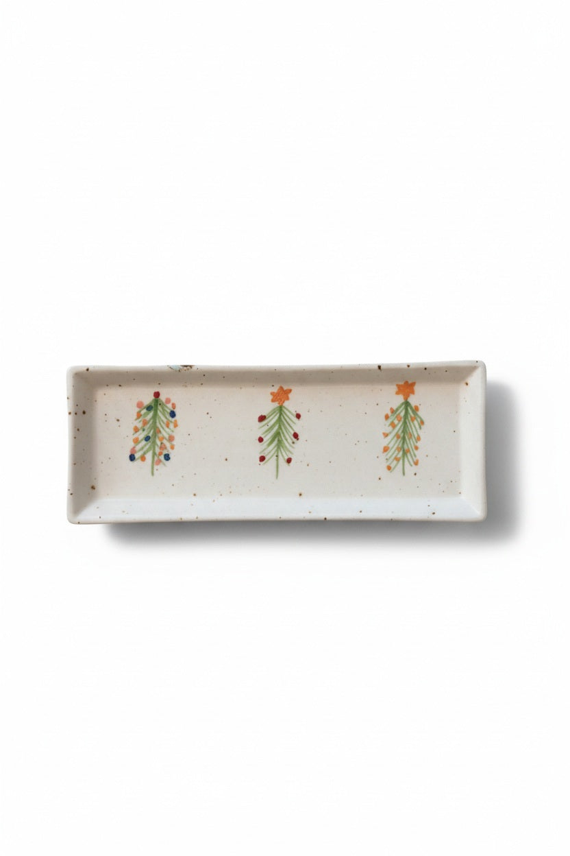 Creative Co-op HAND PAINTED STONEWARE PLATTER WITH TREES: a rectangular white speckled stoneware platter painted with three small Christmas trees, perfect as a holiday serving tray.