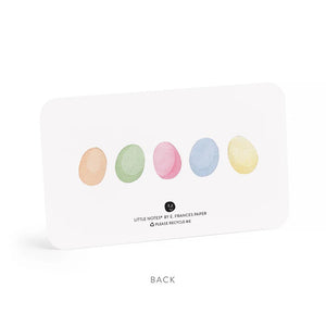 A clear plastic box contains 85 E. FRANCES PAPER - PETER RABBIT LITTLE NOTES. Each notecard features a Peter Rabbit-like illustration with a pink bow-tied white rabbit holding a basket of colorful eggs, under the label "E. Frances 85 Little Notes use unsparingly.