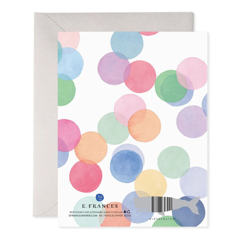 The E. FRANCES PAPER - Falling Confetti Birthday Card from E. FRANCES PAPER showcases handcrafted, overlapping translucent circles in pink, blue, green, and yellow with "Happy Birthday!" in gold on a white background. Made with luxurious paper, it includes a sleek gray envelope ideal for any collection.
