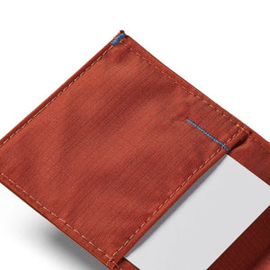 Beads of water on the ALLETT Sport Wallet in RFID-blocking nylon (Potter’s Clay) show its water-resistant, ripstop fabric and minimalist design.