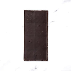 The RITUAL CHOCOLATE - JUNIPER LAVENDER CHOCOLATE bar by RITUAL CHOCOLATE features a purple wrapper with lavender, butterflies, and gold accents. This 70% cacao dark chocolate weighs 2.12 oz (60g) and includes juniper berries and lavender.